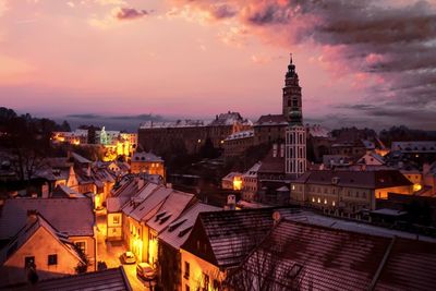 High angle view of illuminated buildings against sky at sunset