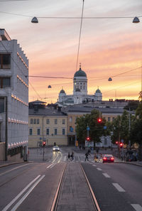 View of city street at sunset