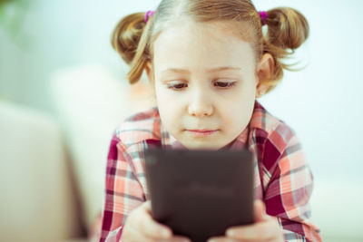 Portrait of boy using mobile phone