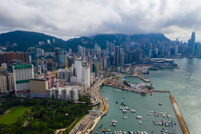 High angle view of bay and buildings against sky