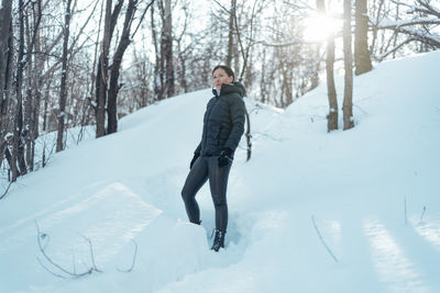 Woman on snow covered field