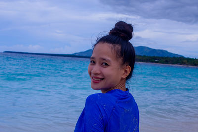 Portrait of young woman at beach