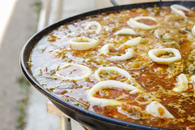 Cooking typical spanish seafood paella