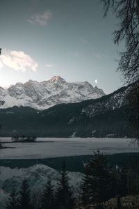 Scenic view of snowcapped mountains and lake against sky