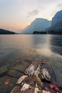 Scenic view of lake against sky during sunset