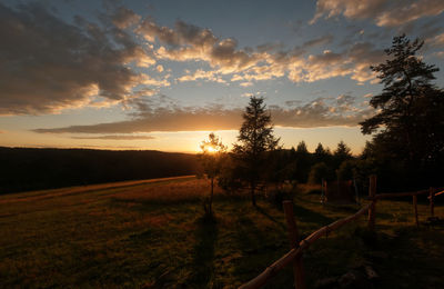 Scenic view of landscape against cloudy sky