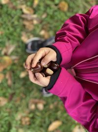 Low section of man holding hands