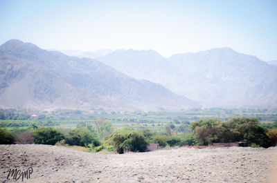 Scenic view of landscape and mountains against sky