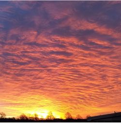 Scenic view of cloudy sky at sunset