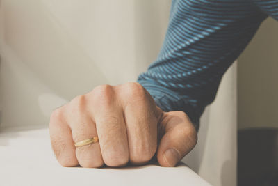 Close-up of hands on table