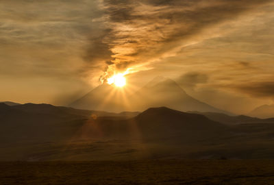 Scenic view of landscape against sky during sunset