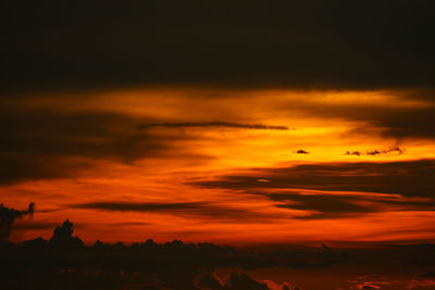 Scenic view of dramatic sky during sunset