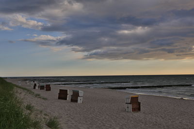 Scenic view of beach against sky during sunset