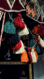 Close-up of multi colored umbrellas hanging at market stall