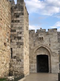 View of historic building against cloudy sky
