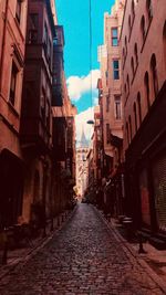 Narrow alley amidst buildings in city