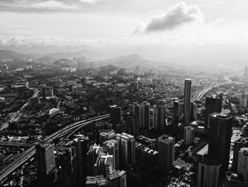 Aerial view of cityscape against sky