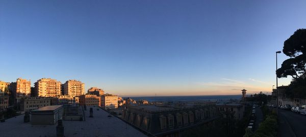 Panoramic view of sea and buildings against clear sky