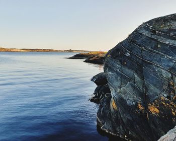 Scenic view of sea against clear sky during sunset