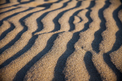 High angle view of shadow on sand