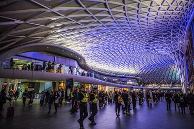 Group of people in illuminated modern building