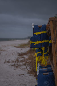 Lifeguard hut on beach against sky