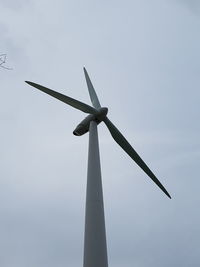 Low angle view of windmill against sky