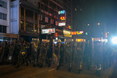 People on city street at night