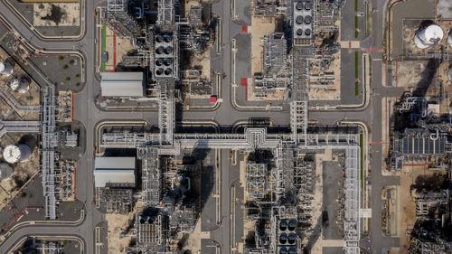 Aerial top view oil and gas refinery petrochemical plant industrial with oil and gas storage tank.