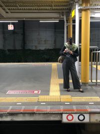 Full length of man standing on bus