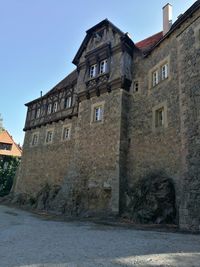 Low angle view of old building against sky