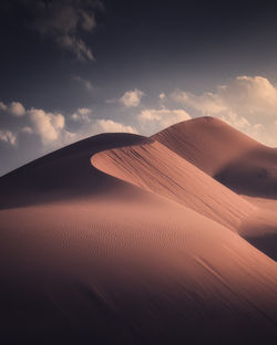 Scenic view of desert against sky during sunset