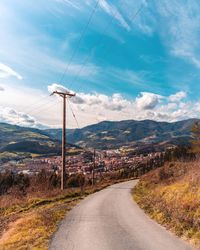 Road amidst landscape against sky