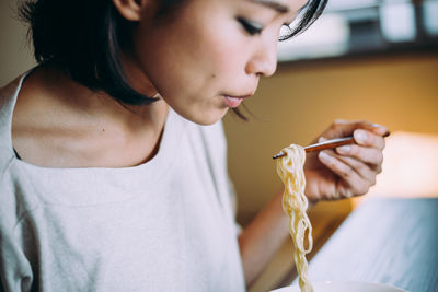 Close-up of young woman looking at camera