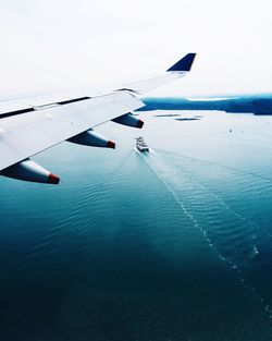 Boats in sea against sky