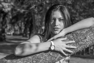 Portrait of woman sitting outdoors