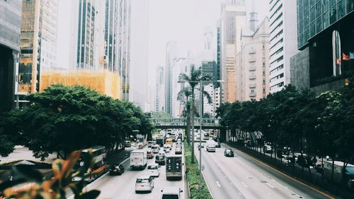 Traffic on city street by buildings