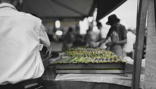 Man working at market stall