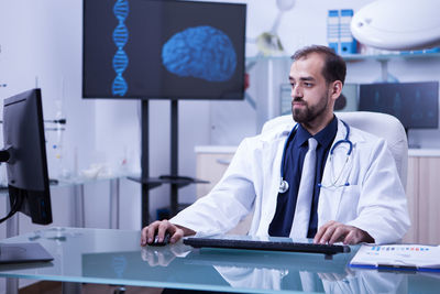 Portrait of doctor standing in laboratory