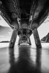 Underneath view of bridge over sea