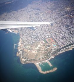 Aerial view of airplane flying over sea