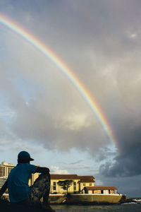 Scenic view of rainbow over city