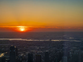 Scenic view of buildings against sky during sunset