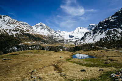 Scenic view of snowcapped mountains against sky