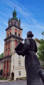 Low angle view of statue against building