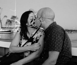 Young couple kissing in water