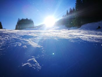 Scenic view of frozen lake against sky during winter