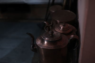 Close-up of old lamp on table