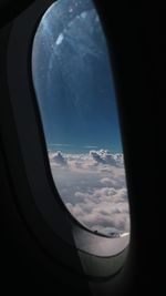 Aerial view of sky seen through airplane window