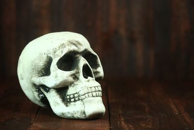 Close-up of human skull on table